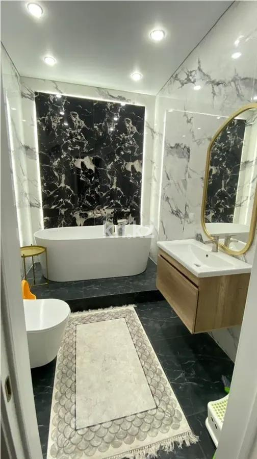 Продажа 4-комнатной квартиры, 118 м², ул. Толе би, дом  63 в Астане - фото 5